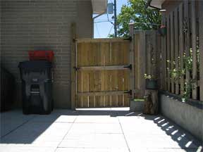 backyard with a fence dividing the yard