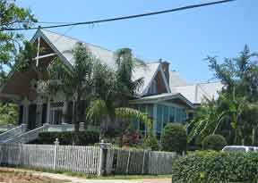 White picket fence in front of a house New Orleans