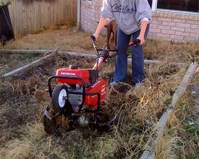rototiller working the ground and the people